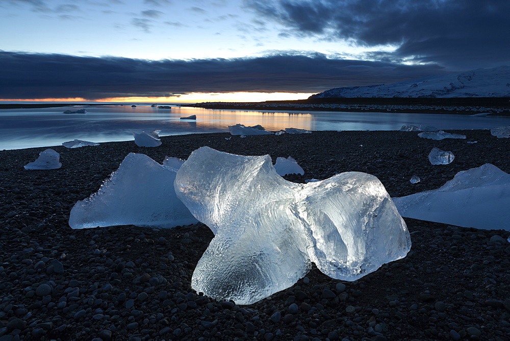 Icebergs at sunset on Jokulsa Beach, on the edge of the Vatnajokull National Park, South Iceland, Iceland, Polar Regions