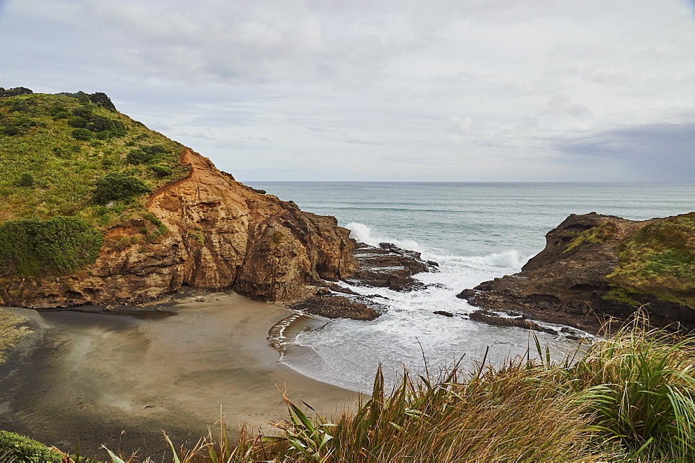 View to the Tasman Sea over volcanic black sand beach at Piha, New Zealand's premier surfing resort, North Island, New Zealand, Pacific