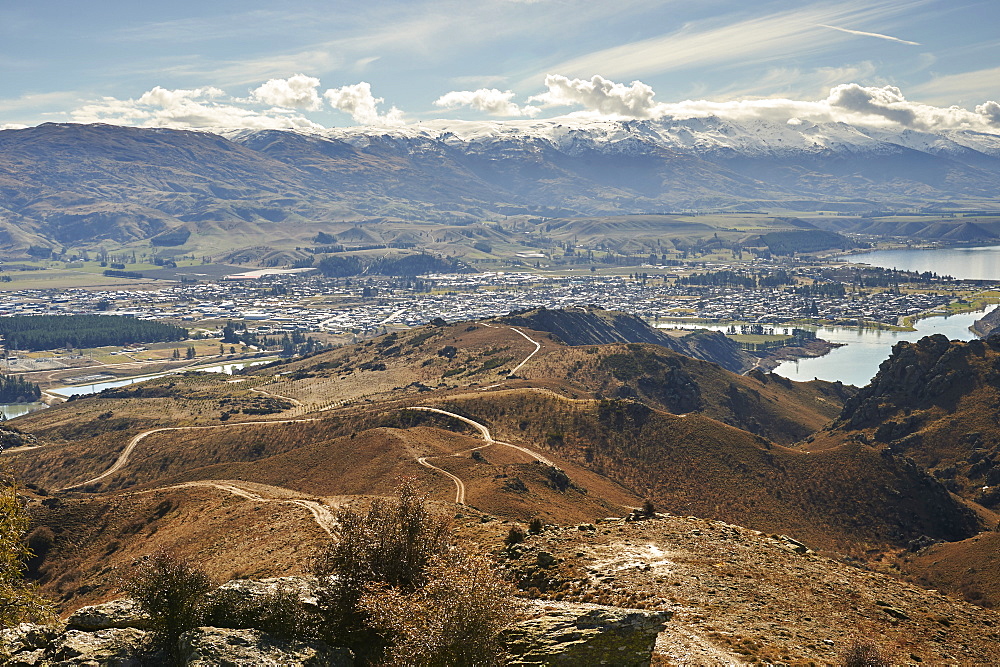 View to outskirts of Cromwell over man-made Lake Dunstan and gold-mining excavations beyond, Otago, South Island, New Zealand, Pacific