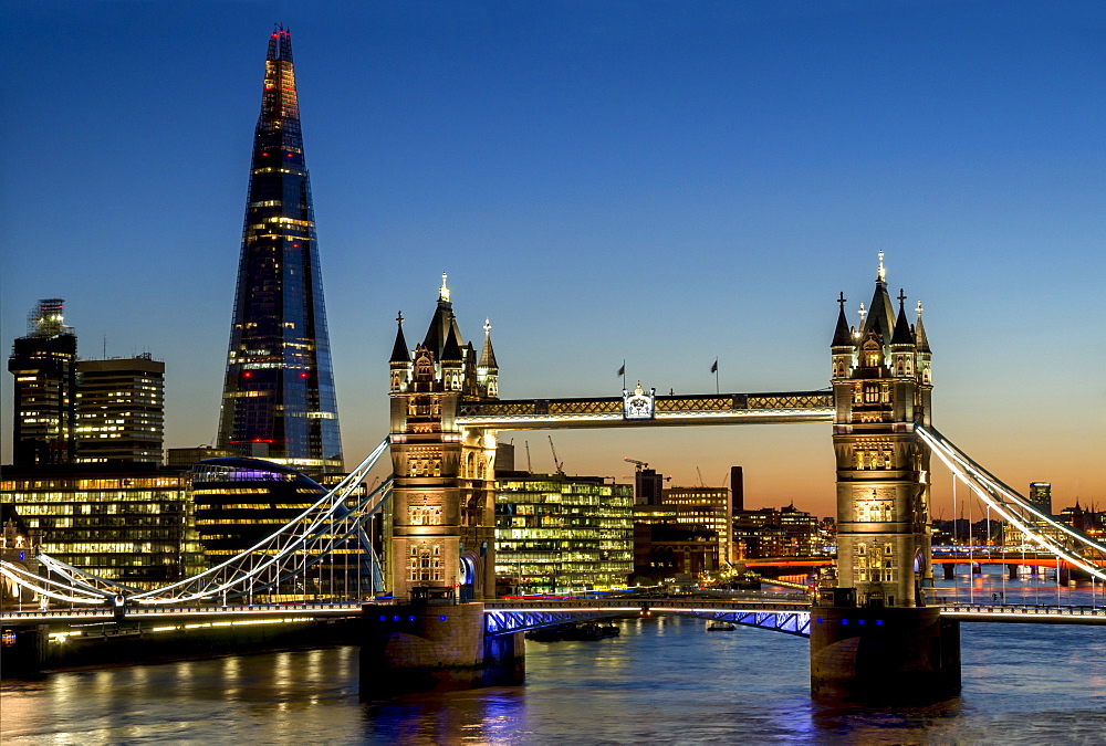 View of the Shard and Tower Bridge standing tall above the River Thames at dusk, London, England, United Kingdom, Europe