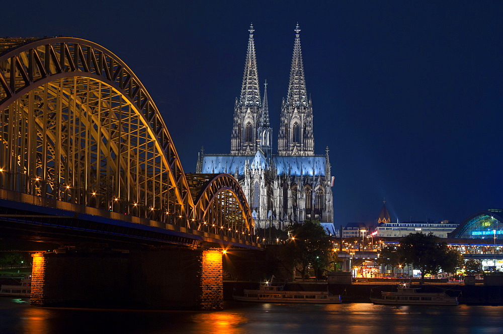 Cologne cathedral, UNESCO World Heritage Site, and Hohenzollern bridge at dusk, Cologne, Germany, Europe