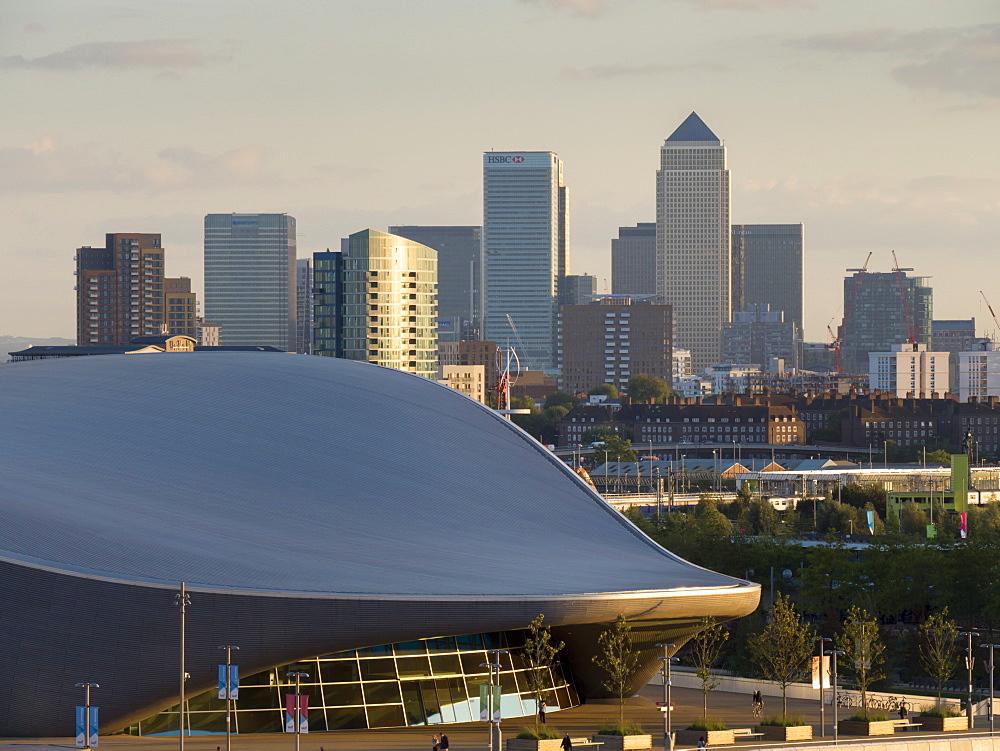 Olympic Park Aquatic Centre with Docklands and Canary Wharf skyline behind, London, England, United Kingdom, Europe 