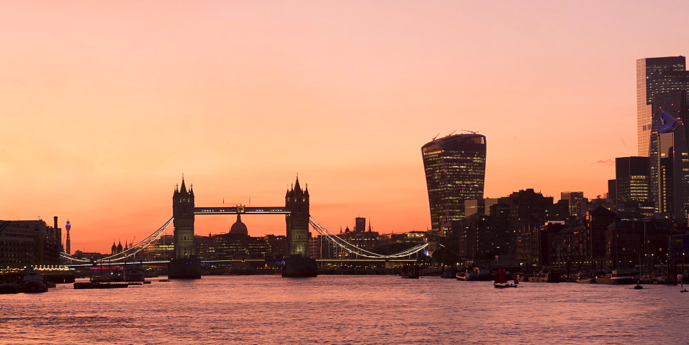 Panoramic view of Tower Bridge framing St. Paul's Cathedral with the City tower blocks at sunset, London, England, United Kingdom, Europe