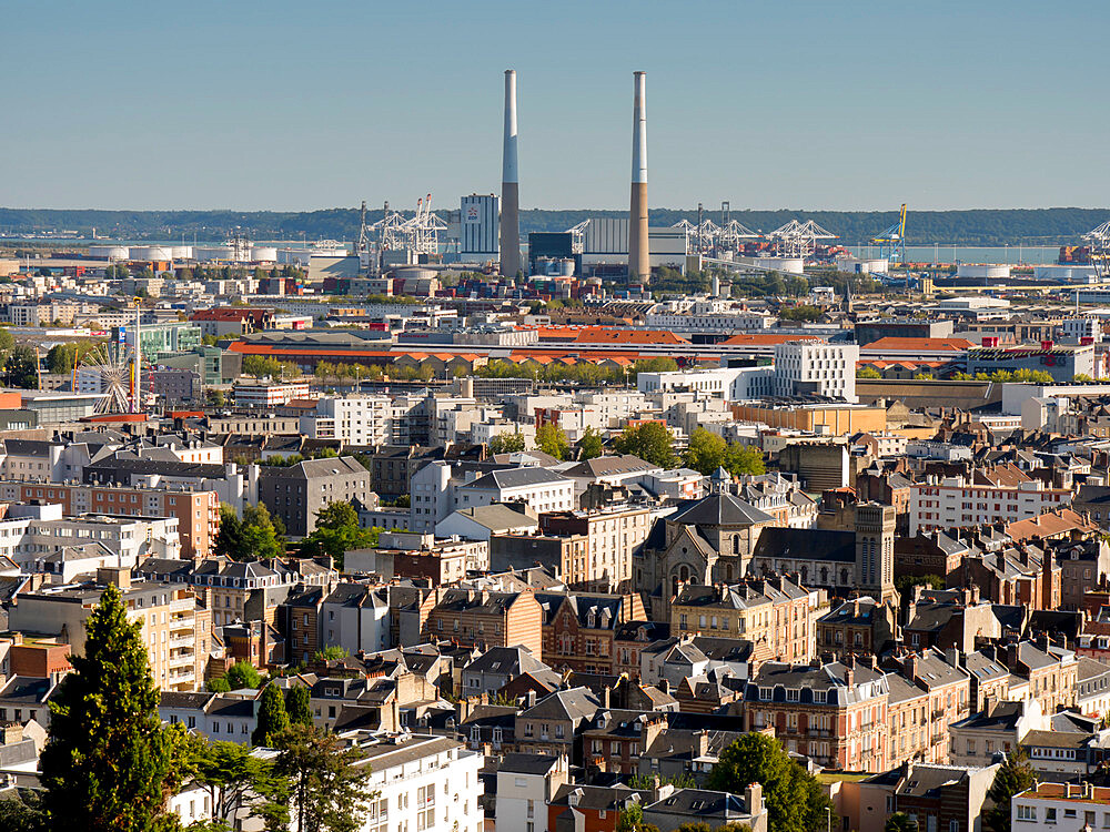 City skyline towards Seine estuary showing iconic twin chimneys, Le Havre, Normandy, France, Europe