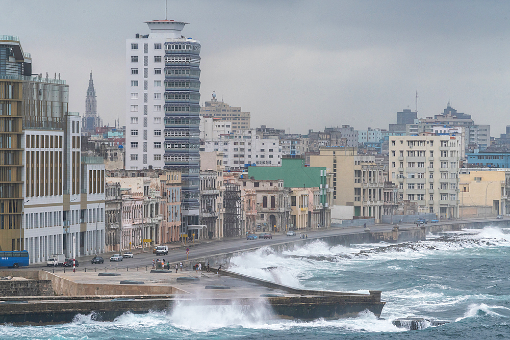 Storm waves batter the seafront Malecon with its faded grandeur stucco houses on Malecon, Havana, Cuba 3