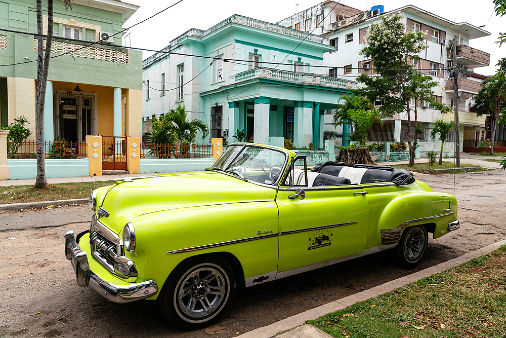 Green open top Chevrolet classic car parked in suburb, Havana, Cuba