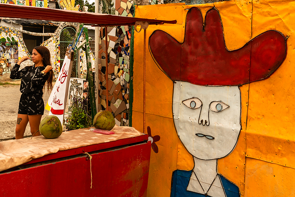 Outside art gallery with young woman in background, Havana, Cuba