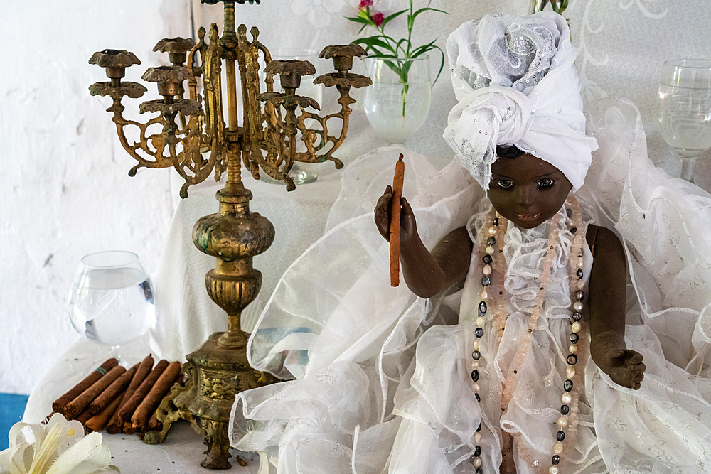 Black doll, cigars and shrine at Santeria Temple (Afro-Cuban religion), Trinidad, Cuba