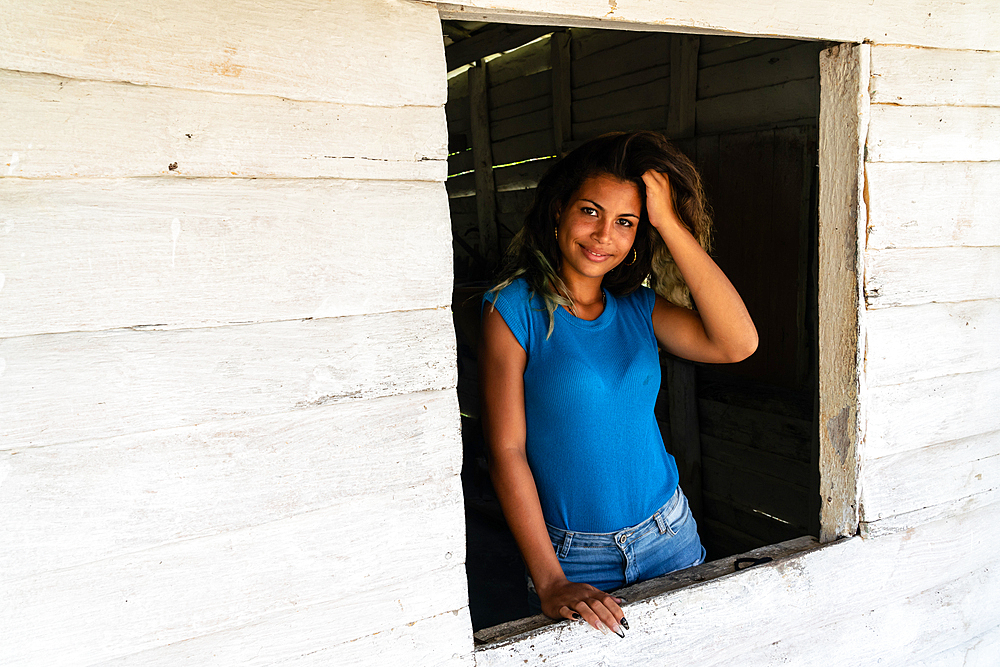 Textile seller at her shop window, Valle de los Ingenios, near Trinidad, Cuba 2 (Model Release)