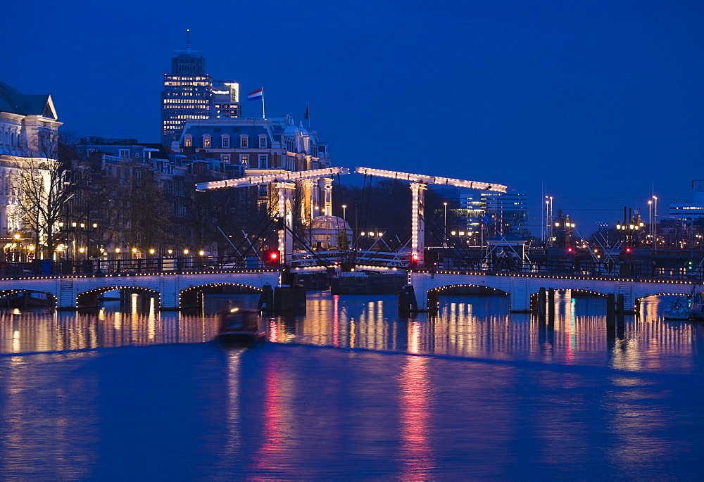 The Magere Bridge at night, also known as the Skinny Bridge, Amstel River, Amsterdam, Netherlands, Europe