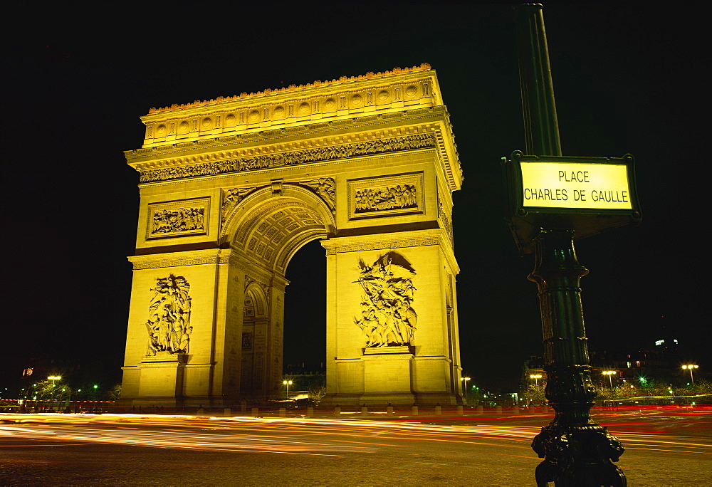 Place Charles de Gaulle street sign and the Arc de Triomphe illuminated at night, Paris, France, Europe