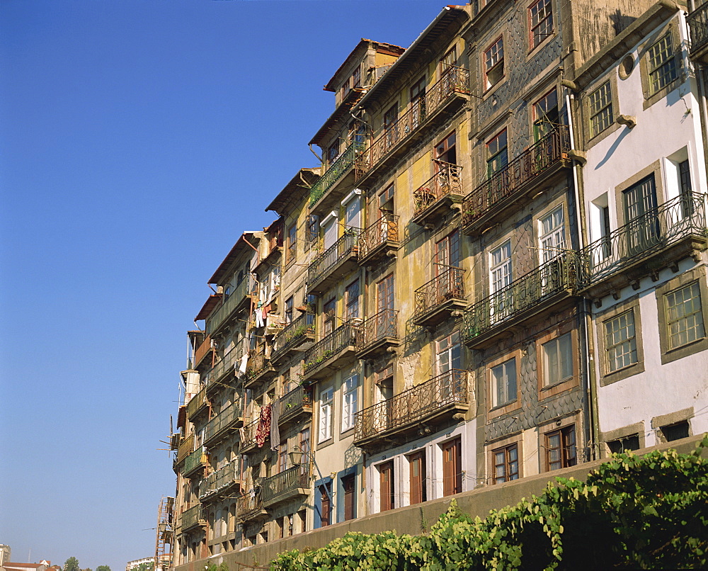 Balconies on the facades of old buildings in the city of Oporto, Portugal, Europe