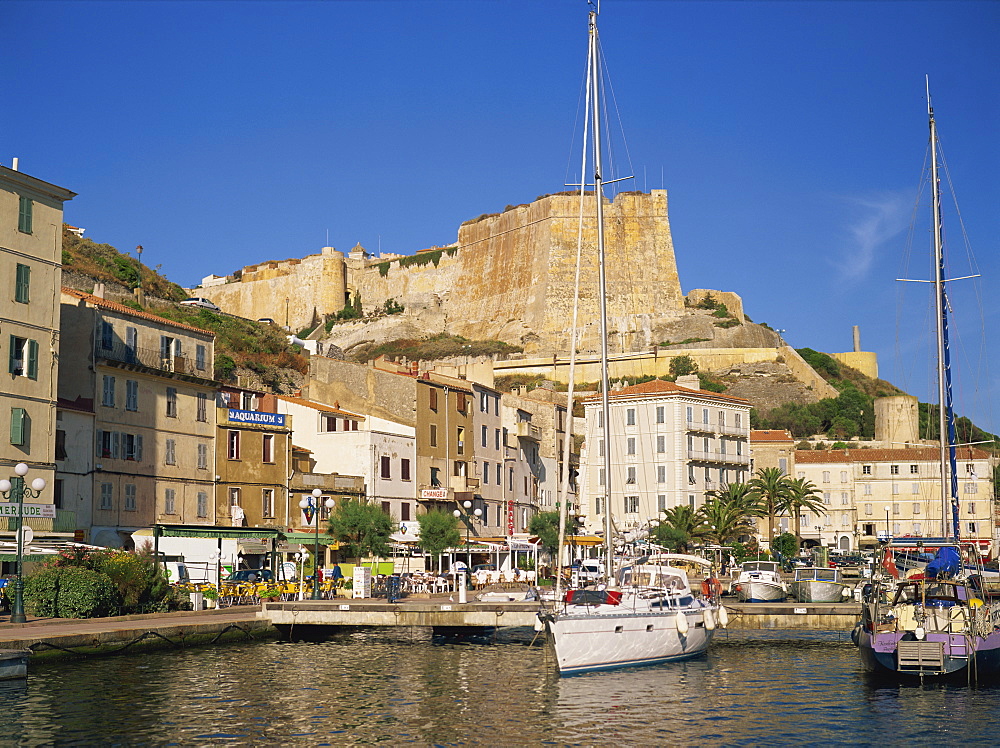 Yacht moored in harbour, with the citadel behind, Bonifacio, Corsica, France, Mediterranean, Europe