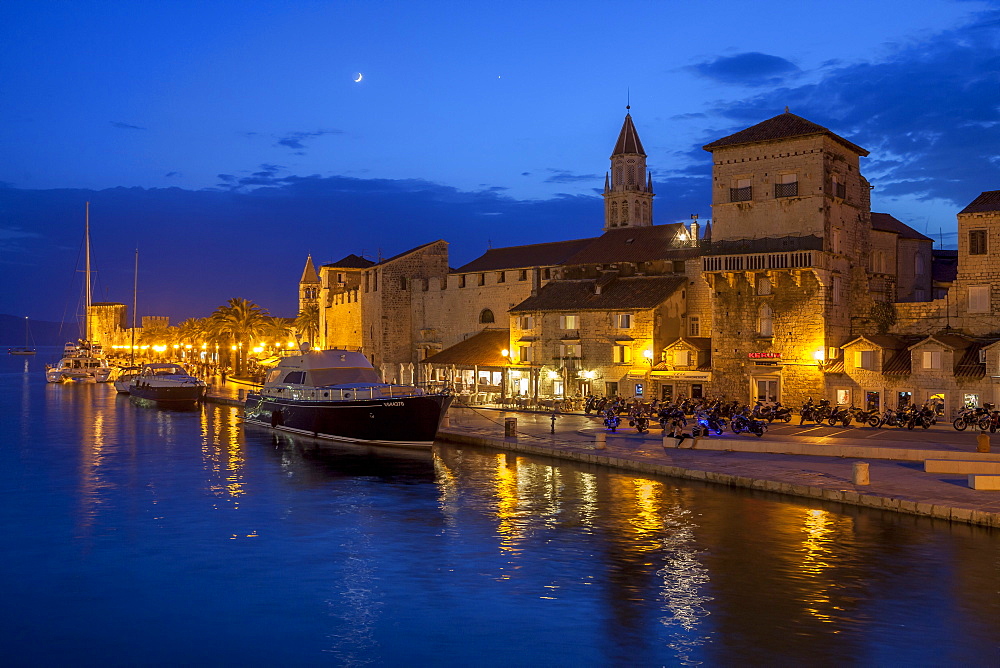 Waterfront lit up at dusk, Trogir, UNESCO World Heritage Site, Dalmatian Coast, Croatia, Europe 