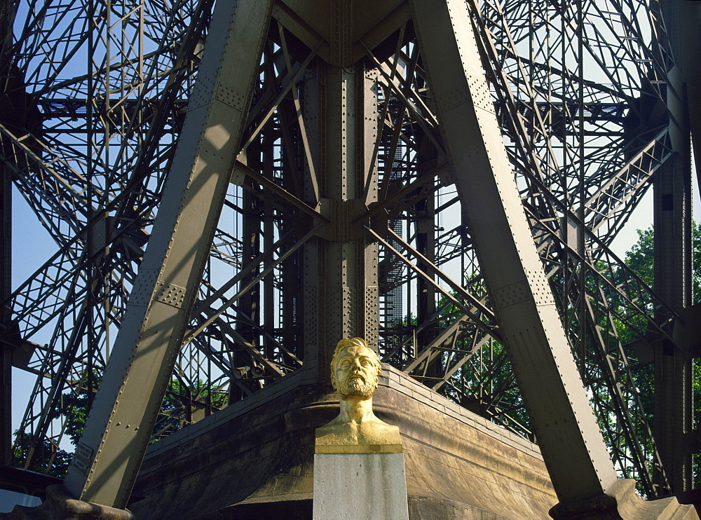 Bust of Gustav Eiffel under his famous landmark, the Eiffel Tower, Paris, France, Europe