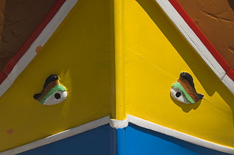 Close-up of a brightly coloured fishing boat (Luzzus) with the eye of Osiris to ward off evil at Marsaxlokk, a fishing village, Malta, Europe