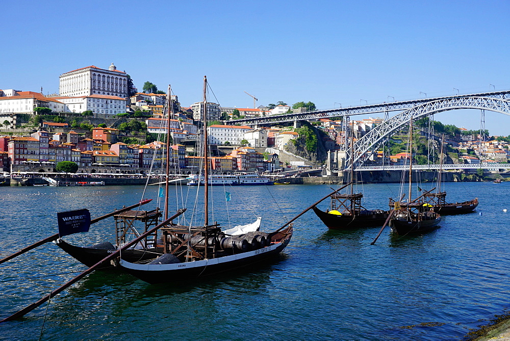 The Bishop's Palace with the Ribeira Quay and Ponte de Dom Luis I bridge over River Douro, Porto (Oporto), Portugal, Europe