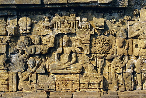 Relief carvings on frieze on outside wall of the Buddhist temple, Borobodur (Borobudur), Java, Indonesia