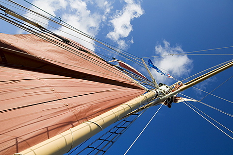 Red sails on sailboat that takes tourists out for sunset cruise, Key West, Florida, United States of America, North America