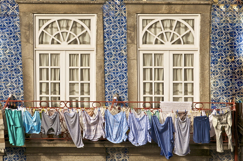 Laundry hanging from window in the Ribeira Quarter, Oporto, Portugal, Europe