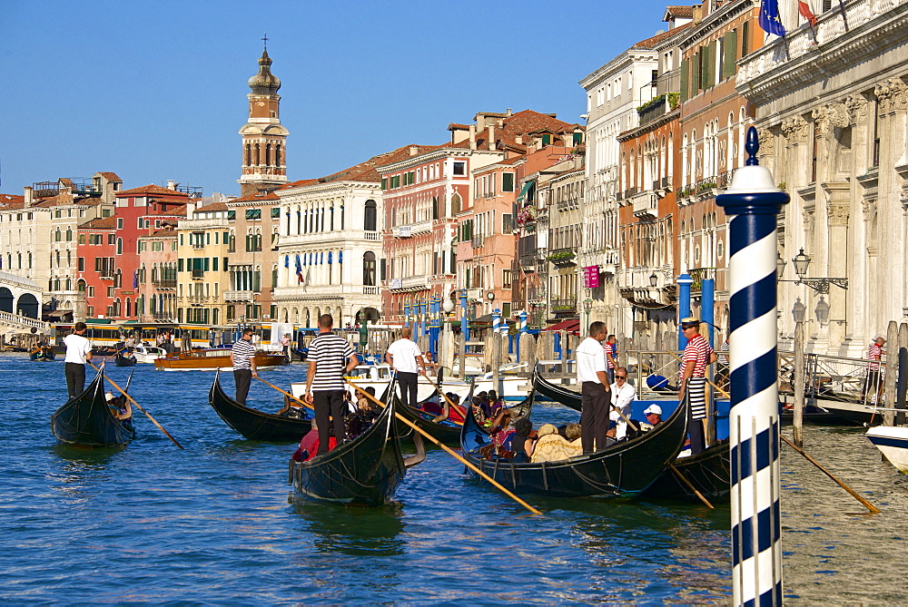 Gondolas and gondoliers, palaces facades and church steeple, Grand Canal, Venice, UNESCO World Heritage Site, Veneto, Italy, Europe