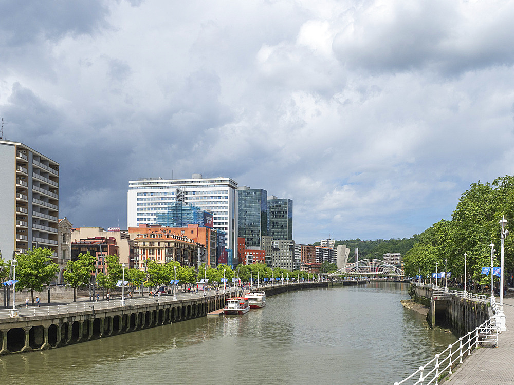 View towards the Calatrava (Zubizuri) Bridge, River Nervion, Bilbao, Basque Country, Spain, Europe