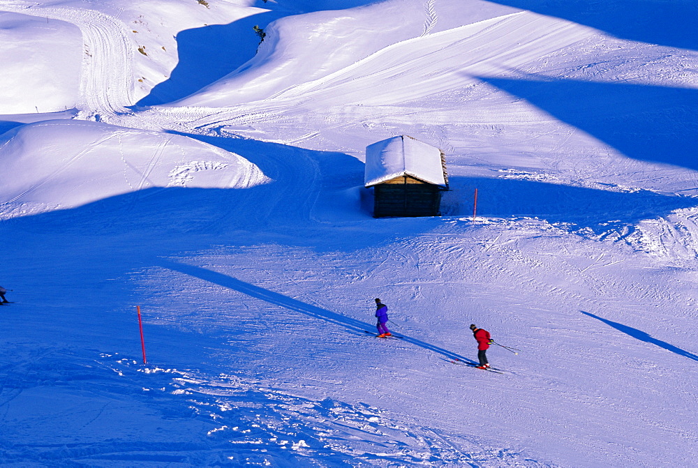 Aerial view of skiers and alpine hut, Kleine Scheidegg, Bernese Oberland, Swiss Alps, Switzerland, Europe