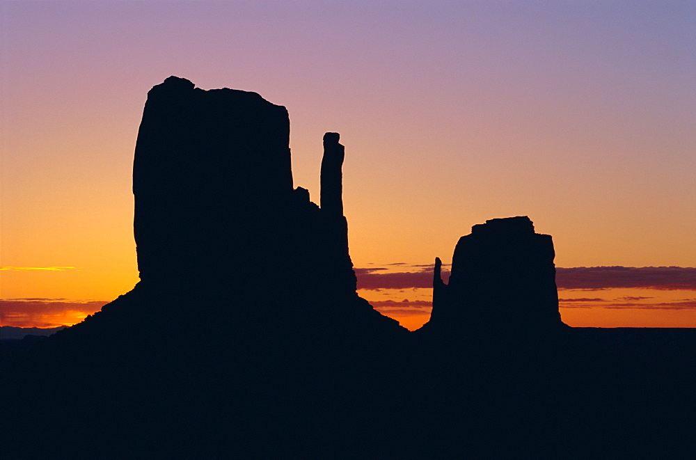 Silhouette of the Mittens at sunrise, Monument Valley, Utah, United States of America (U.S.A.), North America