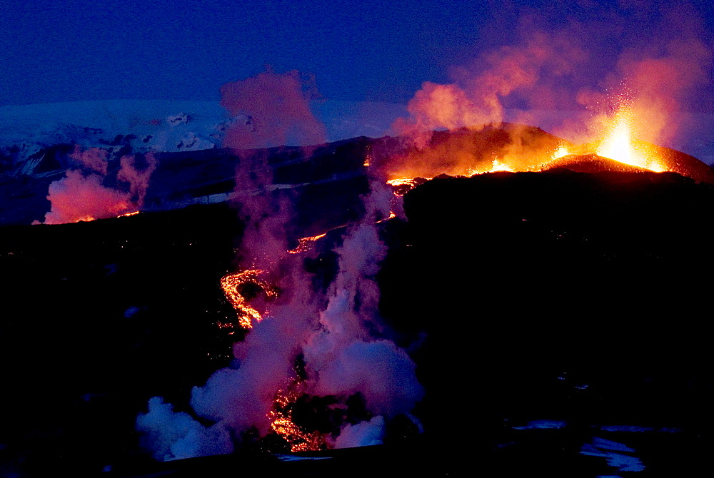 Night view of lava flowing down from Eyjafjallajokull volcano, Iceland, Polar Regions