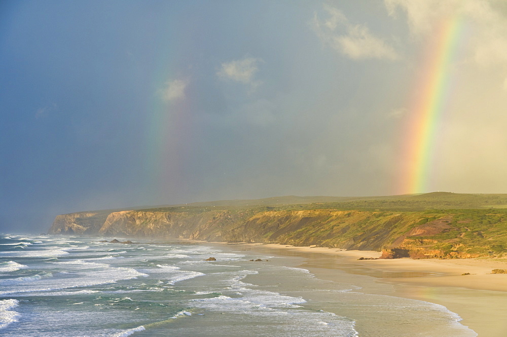 Double rainbow after storm at Carrapateira Bordeira beach, Algarve, Portugal, Europe