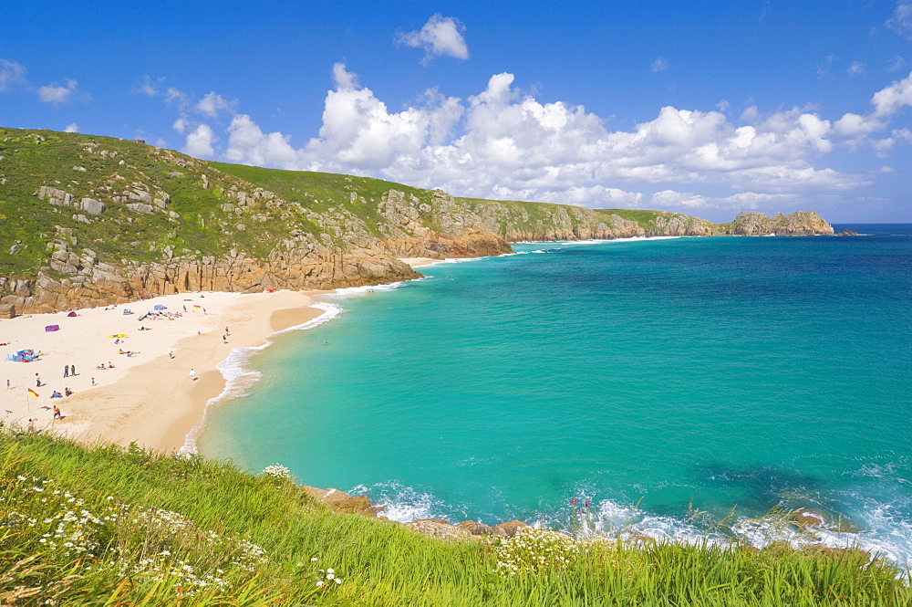 Holidaymakers and tourists sunbathing on Porthcurno beach, Cornwall, England, United Kingdom, Europe