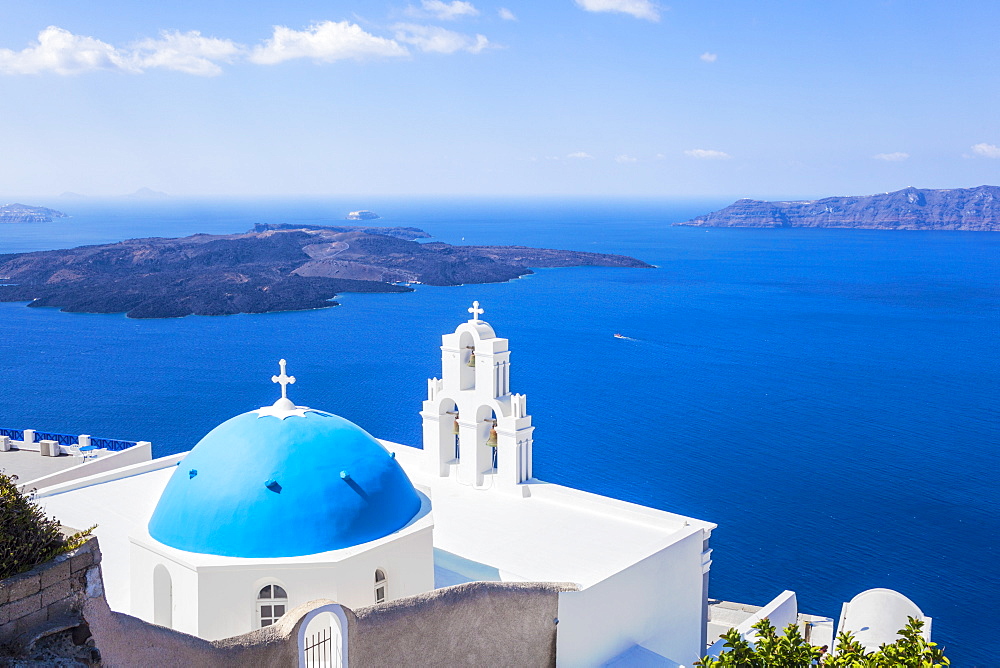 Blue dome and bell tower above Aegean Sea, St. Gerasimos church, Firostefani, Fira, Santorini (Thira), Cyclades Islands, Greek Islands, Greece, Europe