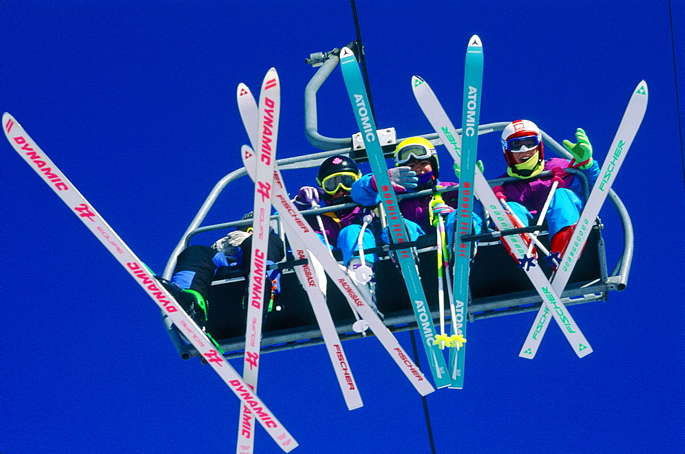 France, Alps, Haute-Savoie, Avoriaz In Winter, Skers On A Chairlift Seen From Below