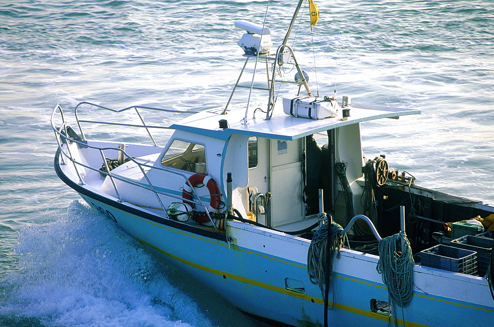 France, Brittany, Illeetvilaine(35), Saint Malo, Small Fishing Boat Returning To Harbour At Dusk