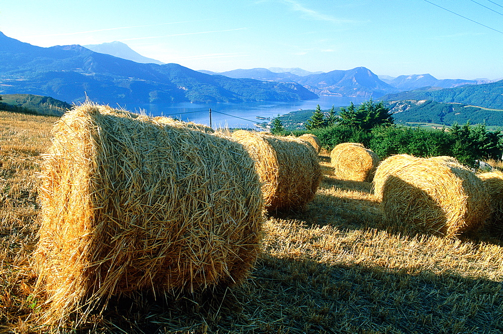 France, Provencealpes, Hautesalpes (05), Serre Poncon Lake And Straw Stack At Fore