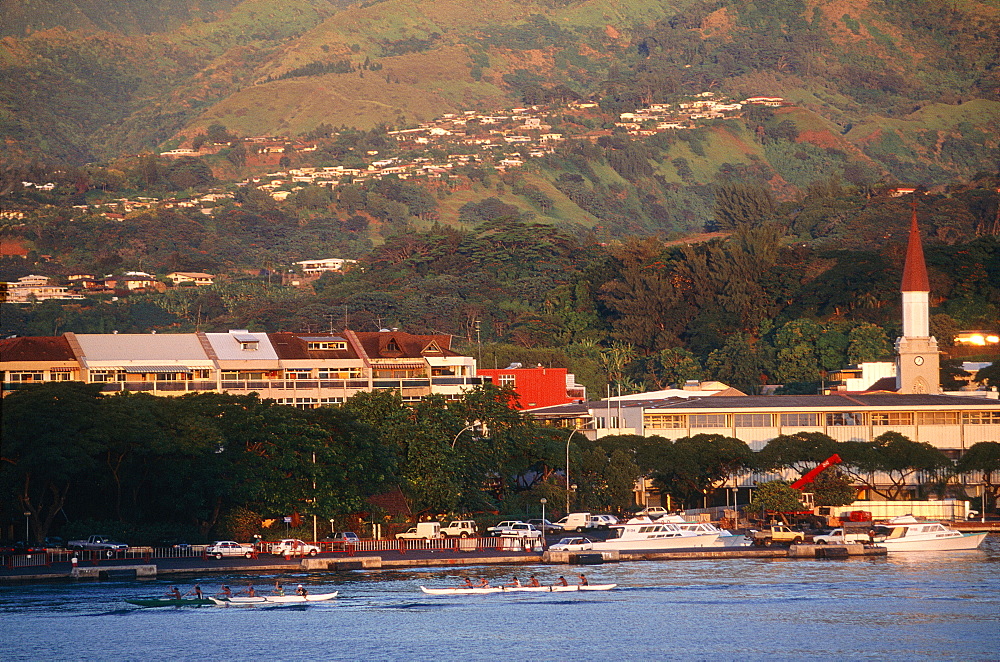 French Polynesia, Tahiti, Papeete Bay At Dusk, Rowers In Outriggers Practising