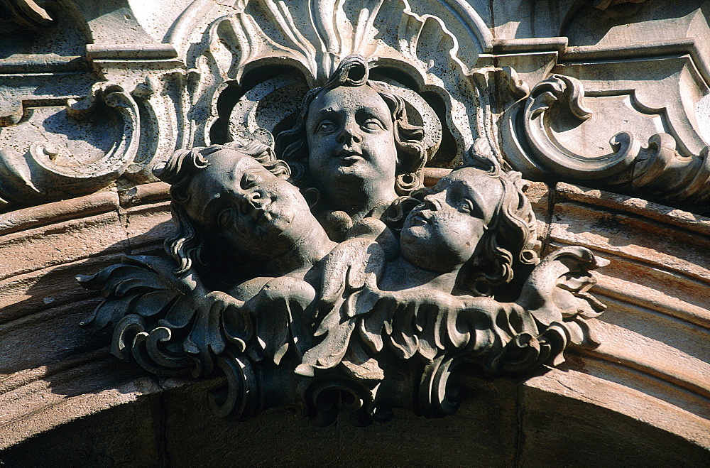 Brazil, Minas Gerais, On Top Of A Hill The Baroque Church Igreja De Sao Francisco De Assis, Sculpture With Three Angels Heads Above The Main Gate 