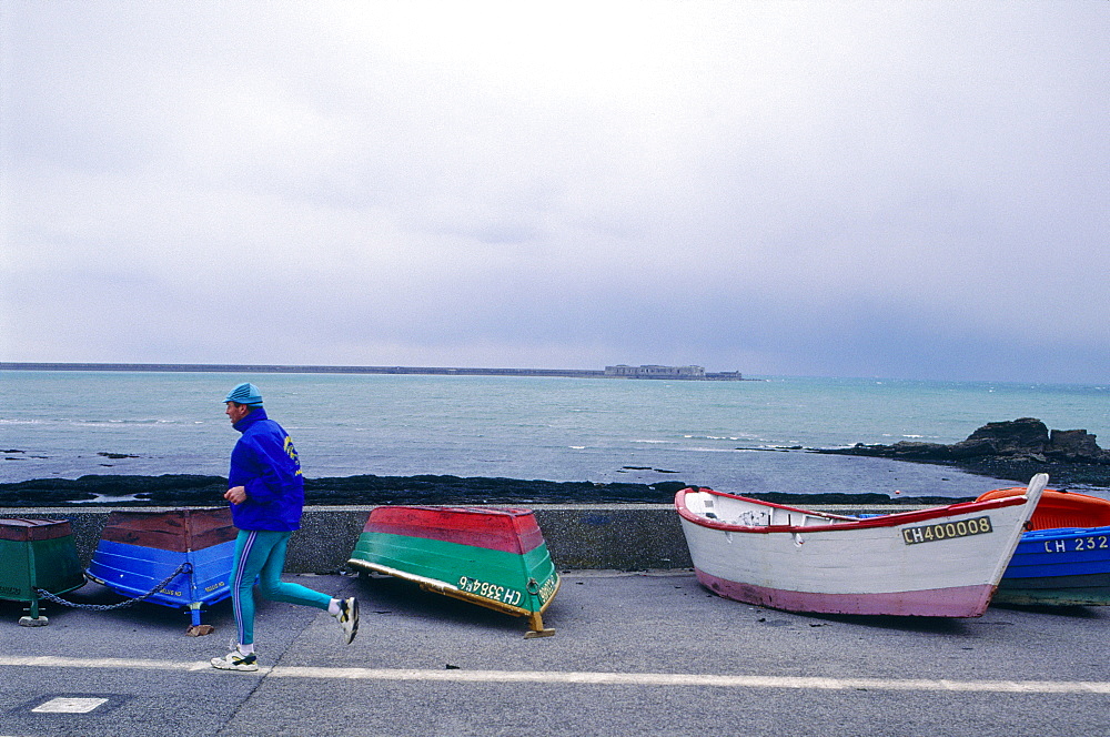 France, Normandy, Manche (50), Cherbourg, Jogger Passing By The Sea Front Promenade, Boats At Rear, Rainy Weather