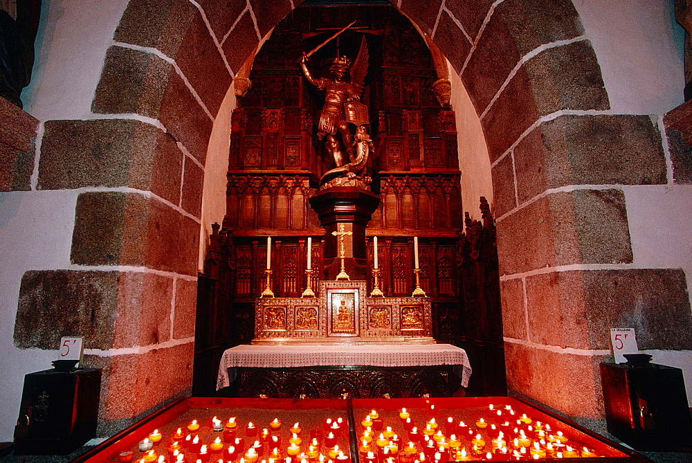 France, Normandy, Manche (50), Mont Saintmichel, St Michel Silver Statue And Burning Candles In The Church