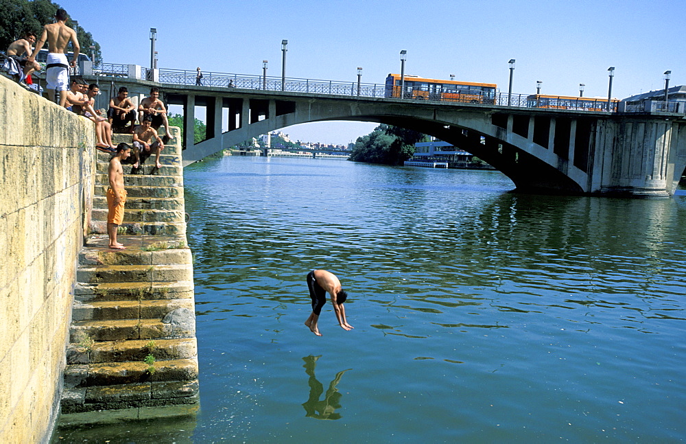 Spain, Andaloucia, Sevilla, Cruise On The Guadalquivir River, Boys Diving At The Telmo Bridge