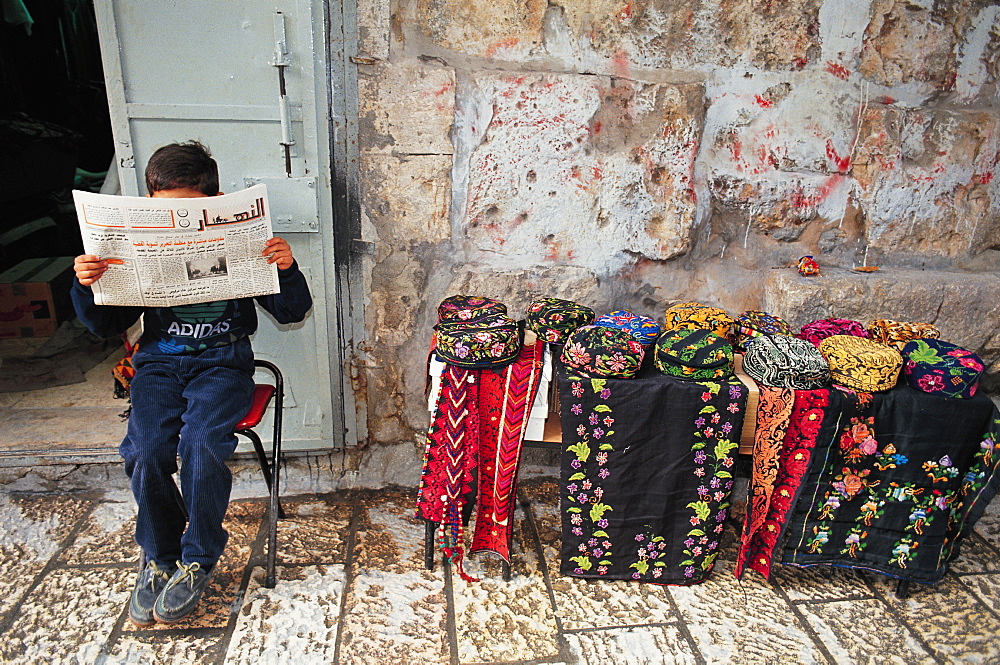 Child Reading A Newspaper, Palestinian Souks, Jerusalem, Israel