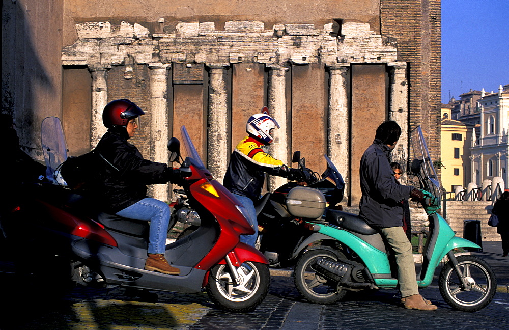 Italy, Rome, Traffic, Bikers Waiting At Red Light, Roman Remains In Wall Behind