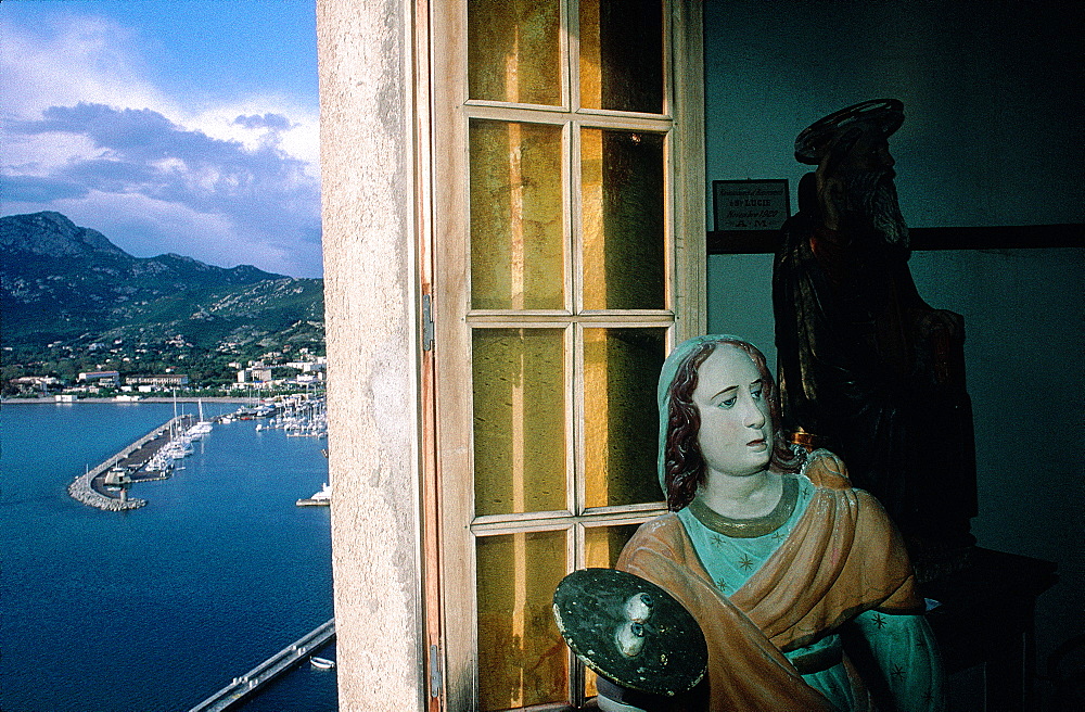 France, Corsica, Balagne, Calvi, Oratory Saint Antoine, Baroque Wooden Statue At Fore, The City Behind