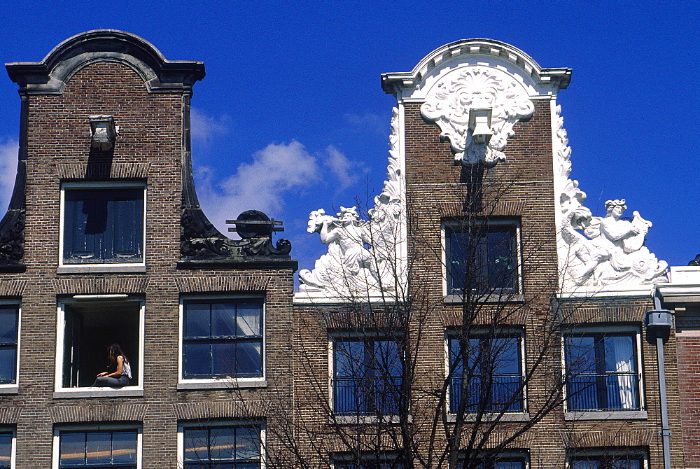 Netherlands, Amsterdam, Frontons Of Old Bricks Houses On A Canal