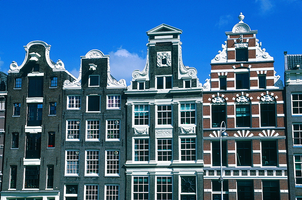 Netherlands, Amsterdam, Front Of Old Bricks Houses On A Canal