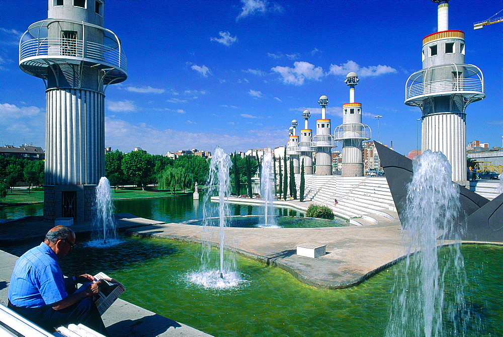 Spain, Catalonia, Barcelona, Industrial Park Designed By Ganchegui And Rius I Camp, Man Reading Newspaper