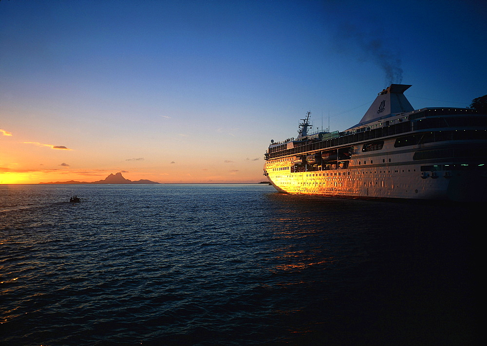 French Polynesia, Gastronomic Cruise On M/S Paul Gauguin, The Ship In Tahaa Lagoon At Sunset, Bora Bora Island Behind 