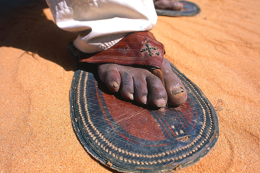 Algeria, Sahara, Djanet Oasis, Tuareg Wearing Large Shoes As Sandshoes For Easier Walking 