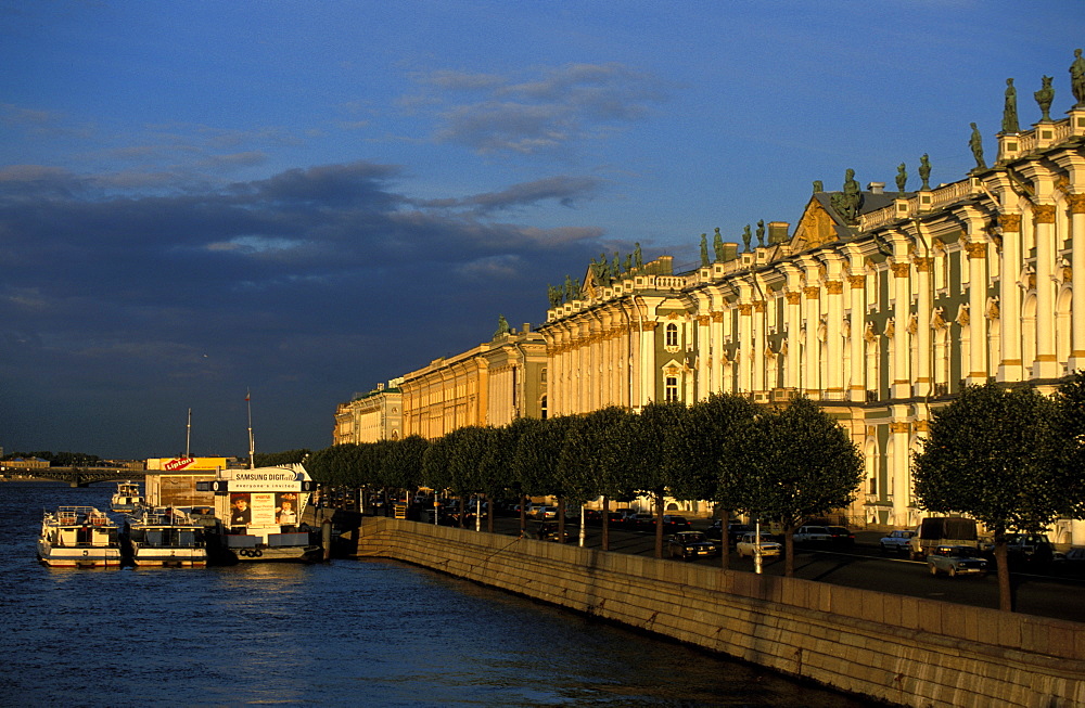 Russia, Saint Petersburg, Hermitage Museum In Winter Palace, The Facade On Neva River At Sunset 