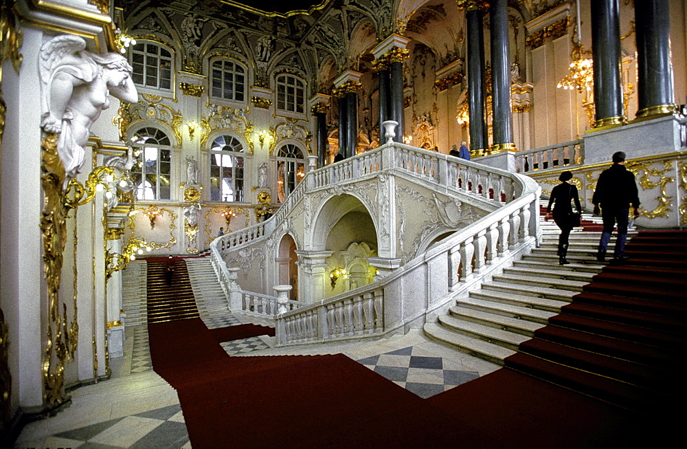 Russia, Saint Petersburg, Hermitage Museum In Winter Palace, Two Visitors Climbing The Main Stairs 